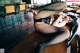 A woman in fishnet stockings laying on a table.